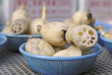 Lotus roots on a vegetables market stand-close up image with selective focus.の写真素材
