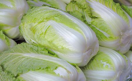 Heap of Chinese cabbages on a market stand-detailの写真素材