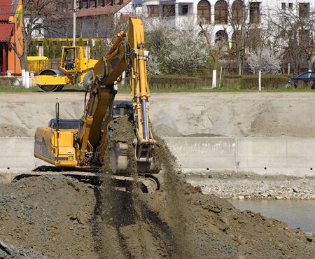 Excavator in action at the construction site.