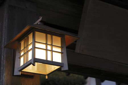 Specific Japanese wooden lantern at the entrance in a wooden building.の写真素材