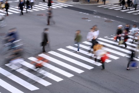 Aspect of a pedestrian cross with motion blurred aspect of the people.          の写真素材