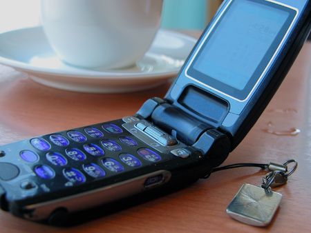        waiting a phone c-mail and drinking a coffee-concept   の写真素材