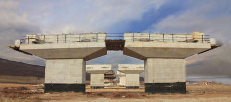 Image of a highway construction site with a beautiful cloudy sky.の写真素材