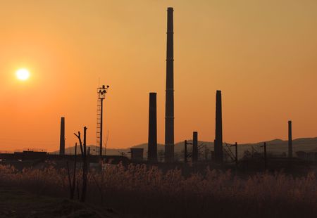 Image of industrial silhouettes at sunset.の写真素材
