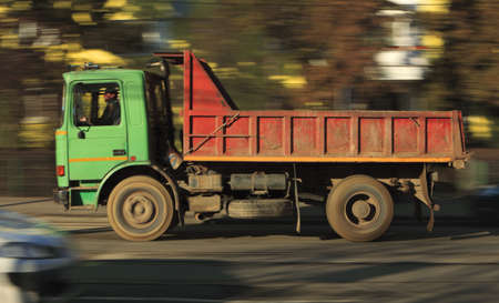 Panning image of a truck in a city street.の写真素材