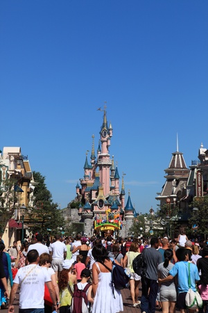 Paris,France,July 11th 2010:Crowd of tourists on the main street in Disneyland Paris.In the distance you can see the Princesse's Castle.のeditorial素材