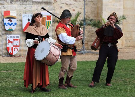Nogent le Rotrou,France,May,16th,2010:A band of three medieval musicians performing in the yard of the castle during the Week-end de L'ascension-Grand Fete medievale. This was a historical reenactment festival around the Saint Jean Castle.のeditorial素材