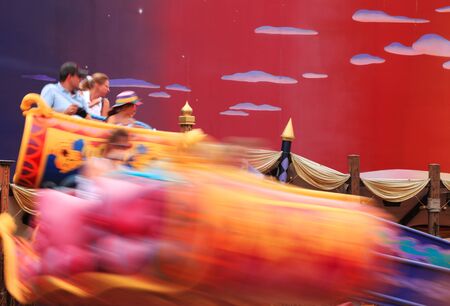Paris,France,July 10th 2010: A family spinning with the "Flying Carpets over Agrabah" in Walt Disney Studios which is the second thematic park in Disneyland Paris.のeditorial素材