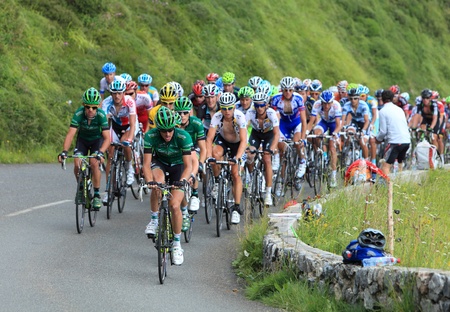 Béost,France,July 15th 2011: Image of the peloton climbing the category H mountain pass Abisque in the 13th stage of the 2011 edition of \"Le Tour de France\", the biggest cycling race in the world.The front of this peloton is formed by the Europcar team のeditorial素材