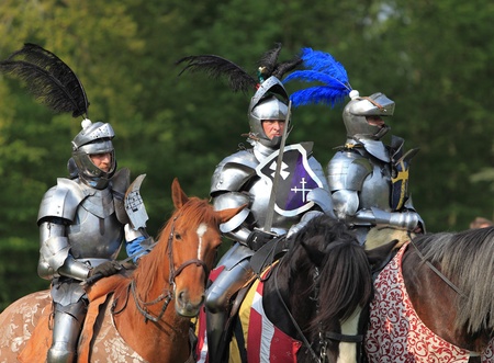 Harcourt, France- April 17th, 2011:Image of three medieval knights ready to start the fight, during a tournament held in Harcout in France, to celebrate 1100 years of existence of Normandy.のeditorial素材