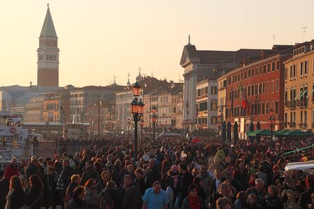 Venice, Italy- February 26th, 2011: Image of crowd of tourists walking in the evening in Sestiere Castello in Venice. Sestiere Castello (The Castello District) is the largest district in Venice and it has a special Italian atmosphere all the year long.のeditorial素材