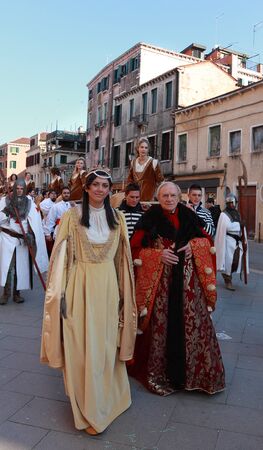 Venice,Italy,February 26th 2011: Medieval characters marching in a costume parade in Venice during...