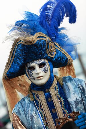 Venice,Italy- February 26th, 2011:nImage of a person disguised in a blue Venetian costume and mask during the Venice Carnival days.The Carnival of Venice (Carnevale di Venezia) is an annual festival, held in Venice, Italy and is now established as one of のeditorial素材