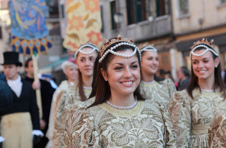 Venice,Italy-February 26th, 2011: A beautiful young woman on Sestiere Castello in Venice paticipate in a medieval characters parade during The Carnival days.The Carnival of Venice (Carnevale di Venezia) is an annual festival, held in Venice, Italy and is のeditorial素材