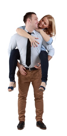 Image of a young couple having fun together against a white background.の写真素材