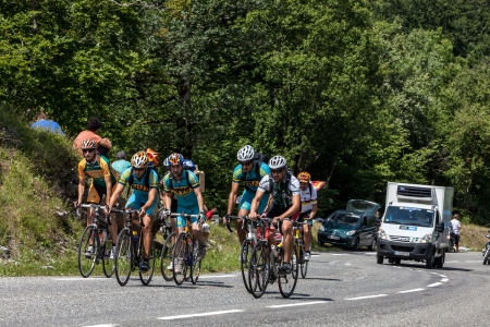 Eaux Bonnes,France, July 15th 2011: A group of amateur cyclists climbing the road to mountain pass Abisque, in Pyrenees mountains, before arrival the professional cyclists during the 13th stage of Le Tour of France 2011.のeditorial素材