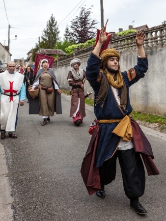 Nogent le Rotrou, France- May 19th, 2012: Parade of medieval characters with a traditional costumes marching near the Saint Jean Castle in Nogent le Rotrou,France, during a a historical reenactment festival.のeditorial素材