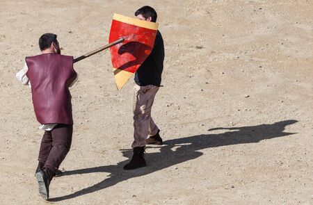 Montmedy, France, April 29th, 2012: Bird eye view of two medieval men fighting during a historical festival in Montmedy, France.のeditorial素材