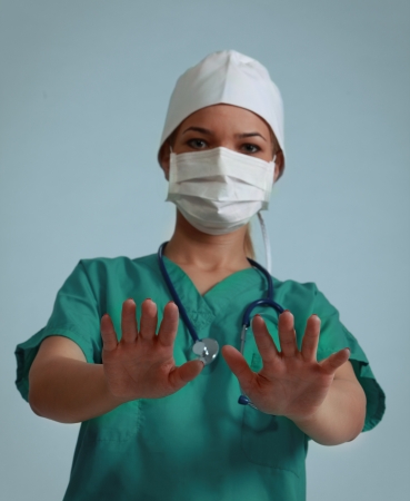 Image of a female doctor preparing to palpate a patient. Selective focus on the hands.の写真素材