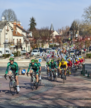 Saint-Pierre-lÃ¨s-Nemours,France- March 4, 2013: Image of the cyclists from Europcar team, including the Yellow Jersey of the day (the cyclist Damien Gaudin),riding in front of the peloton, during the first stage of the famous road bicycle race Paris-Niceのeditorial素材