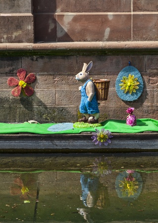 Colmar,France- April 23rd, 2011: A boat funny decorated specifically for Easter on a canal in Colmar in Alsace, France.のeditorial素材