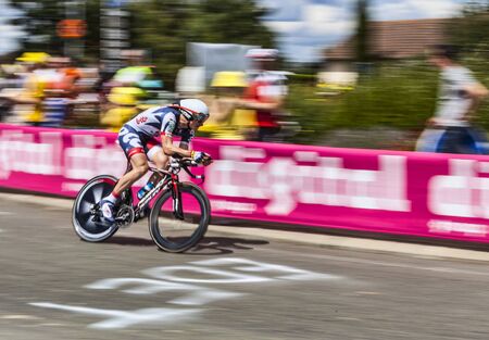 Illiers Combray, France, July 21st 2012: Paning image of the German cyclist Andre Greipel (Team Lotto Belisol) riding during the 19th stage- a time trial between Bonneval and Chartres- of \"Le Tour de France\" 2012.のeditorial素材
