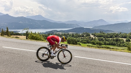 Chorges, France- July 17, 2013: The French cyclist Guillaume Levarlet from Cofidis Solution Credits Team pedaling during the stage 17 of 100th edition of Le Tour de France 2013, a time trial between Embrun and Chorges.In the background is a beautiful landのeditorial素材