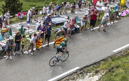 Col de Pailheres,France- July 06 2013  Supporters cheering and encouraging the French cyclist Cyril Gautier from Team Europcar climbing the road to Col de Pailheres in Pyrenees Mountains during the stage 8 of the 100 edition of Le Tour de France on 6 Julyのeditorial素材