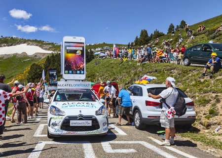 Port de Pailheres,France- July 06 2013 Alcatel One Touch car during the passing of the publicity caravan on the climbing route to mountain pass Pailheres in Pyrenees Mountains during the 8th stage of the 100 edition of Le Tour de France, the biggest cycliのeditorial素材