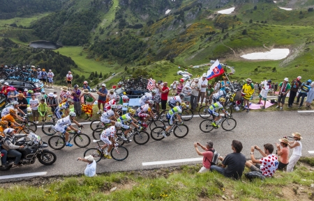 Col de Pailheres,France- July 06 2013  The peloton climbing the road to Col de Pailheres in Pyrenees Mountains during the stage 8 of the 100 edition of Le Tour de France on 6 July 2013 のeditorial素材
