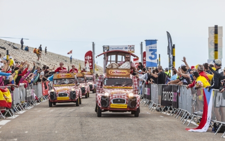 Mont Ventoux, France- July 14 2013 Cochonou cars during the passing of the publicity caravan in the last kilometer of the ascension to Mont Ventoux during the stage 15 of the 100 edition of Le Tour de France 2013   Cochonou is an important French brand ofのeditorial素材