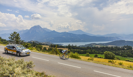 Chorges, France- July 17, 2013  The Argentine cyclist Juan Antonio Flecha from Vacansoleil-DCM Team pedaling during the stage 17 of 100th edition of Le Tour de France 2013, a time trial between Embrun and Chorges In the background is the lake Serre-Ponconのeditorial素材