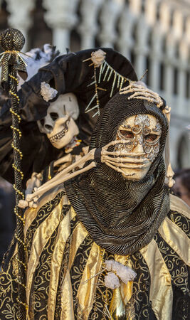 Venice,Italy- February 18, 2012  Environmental portrait of an unidentified person wearing a scary skeleton disguise during the Venice Carnival days のeditorial素材
