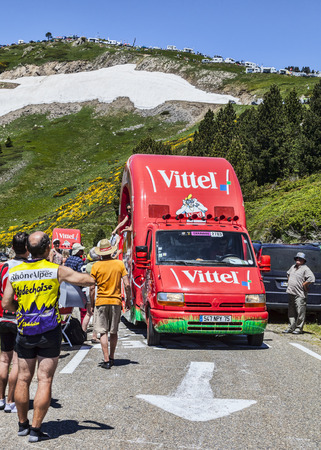 Col de Pailheres,France- July 06 2013 A vehicle advetising Vittel on the road to Col de Pailheres  Pyrenees Mountains , during the passing of the publicity caravan before the apparition of the peloton during the stage 8 of the 100 edition of Le Tour de Frのeditorial素材