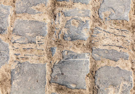 Detail of a cobbelstone road located in the North of France near Lille  On such roads every year is...