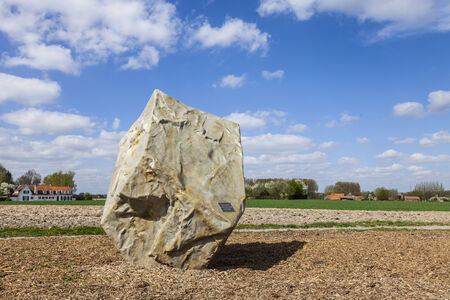 Templeuve,France- April 5, 2014  Image of a monument dedicated to the Paris-Roubaix cycling race located close to one of the famous cobblestones segment of the race near the  de Vertain  Paris-Roubaix in one of the most famous one day pro cycling race which takes place every year in the North of France and pass more segments of a very rough terrain and cobblestonesのeditorial素材