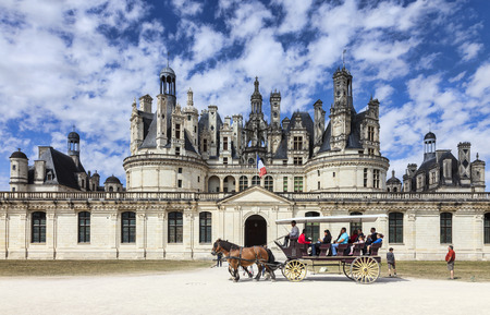 Chambord,France-September 08,2013  A carriage with tourists passing in front of the Chambord Castle  Chambord is royal medieval French castle in Loire Valley - UNESCO heritage site のeditorial素材