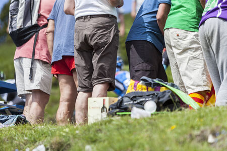 Port de Pailheres,France- July 06 2013 Legs of passionate spectators cheering the cyclists on the road to Col de Pailheres in Pyrenees Mountains during the 8th stage of the 100 edition of Le Tour de France, the biggest cycling race in the world, on 6thJulのeditorial素材