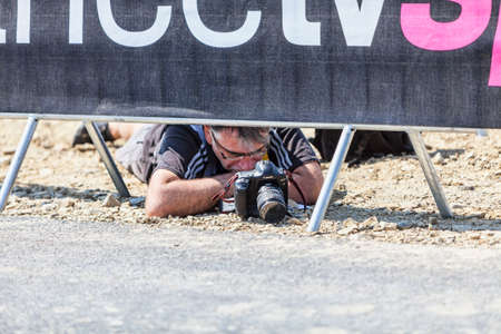Le Mont Saint Michel,France-July 10, 2013: Image of a sport photographer looking to the camera