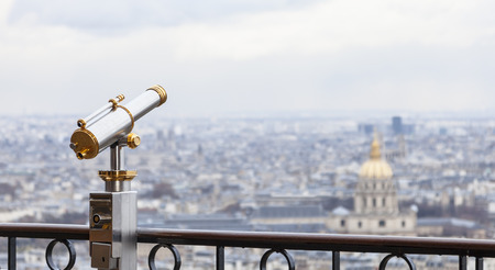 Telescope located on the first level of The Eiffel Tower useful for admiring the Parisian panorama surrounding The Thomb of Napoleon.の写真素材