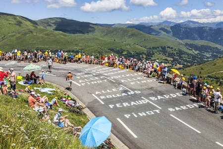Col de Peyresourde,France- July 23, 2014: Image of spectators waiting on the roadside for the peloton during the stage 17 of Le Tour de France on 23 July 2014.のeditorial素材