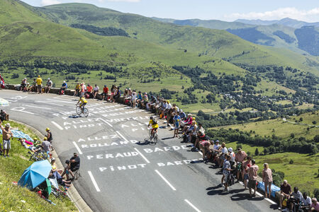 Col de Peyresourde,France- July 23, 2014: Image of amateur cyclists climbing the road to Col de Peyresourde, before the apparition of the peloton in the stage 17 of Le Tour de France on 23 July 2014.のeditorial素材