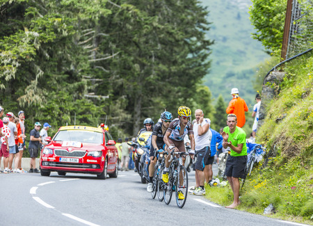 Col du Tourmalet, France - July 24, 2014: The cyclists Blel Kadri (Ag2r-La Mondiale Team) and Mikel Nieve Iturralde (Team Sky) climbing the difficult road to Col du Tourmalet in Pyrenees Mountains during the stage 18 of Le Tour de France 2014. These two cのeditorial素材