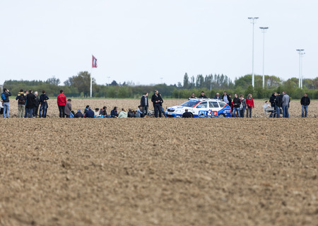 CAMPHIN EN PEVELE,FRANCE-APR 13:The official car of FDJ team driving on the cobblestone sector Carrefour de Arbre in Camphin-en-Pevele on April 13 2014 during Paris-Roubaix cycling raceのeditorial素材