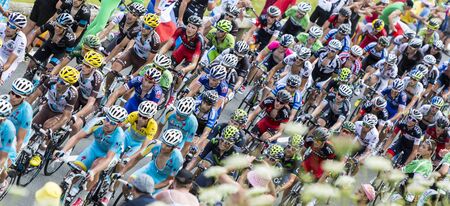 Col de PeyresourdeFrance July 23 2014: Upper view of the peloton climbing the road to Col de Peyresourde in Pyrenees Mountains during the stage 17 of  Le Tour de France on 23 July 2014.のeditorial素材