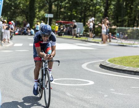 Coulounieix Chamiers France  July 26 2014: The French cyclist Jerome Pineau IAM Cycling Team pedaling  on a steep slope in front of spectators during the stage 20  time trial Bergerac  Perigueux of Le Tour de France 2014.のeditorial素材