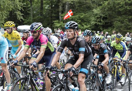 Le Markstein, France- July 13, 2014:The peloton,including Vincenzo Nibali in Yellow Jersey, riding on the road to mountain pass Le Markstein during the stage 9 of Le Tour de France 2014.のeditorial素材