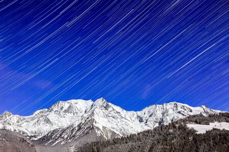 Star trail over the Mont Blanc Massif, the highest mountain of Europe.の写真素材