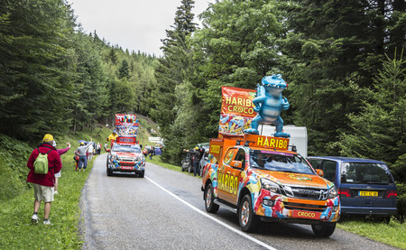 Col de Platzerwasel, France - July 14, 2014: Haribo vehicles during the passing of the publicity caravan on the road to the mountain pass Platzerwasel during the stage 9 of Le Tour de France 2014. Haribo is the biggest manufacturer of gummy and jelly sweeのeditorial素材