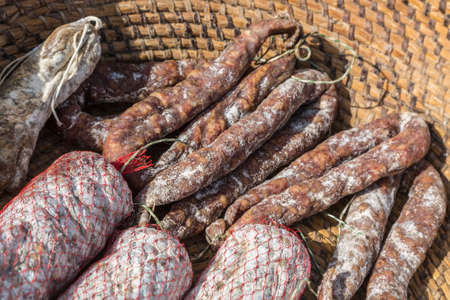Various types of traditional French dry sausages - street market detail.の写真素材